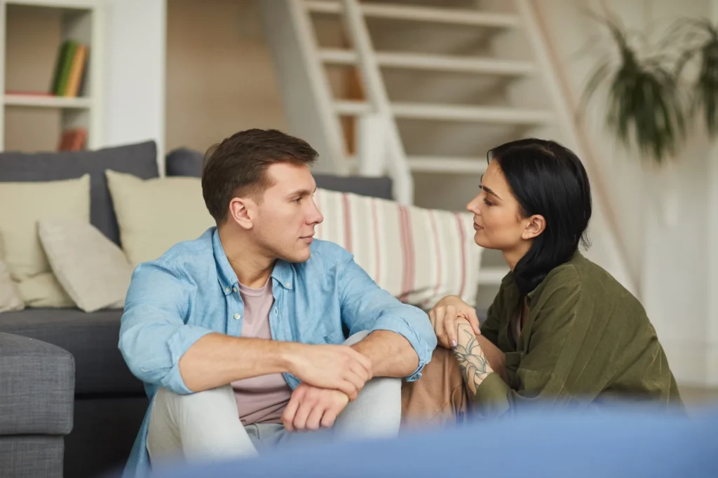 Peaceful couple sitting together discussing terms of collaborative divorce in Houston.