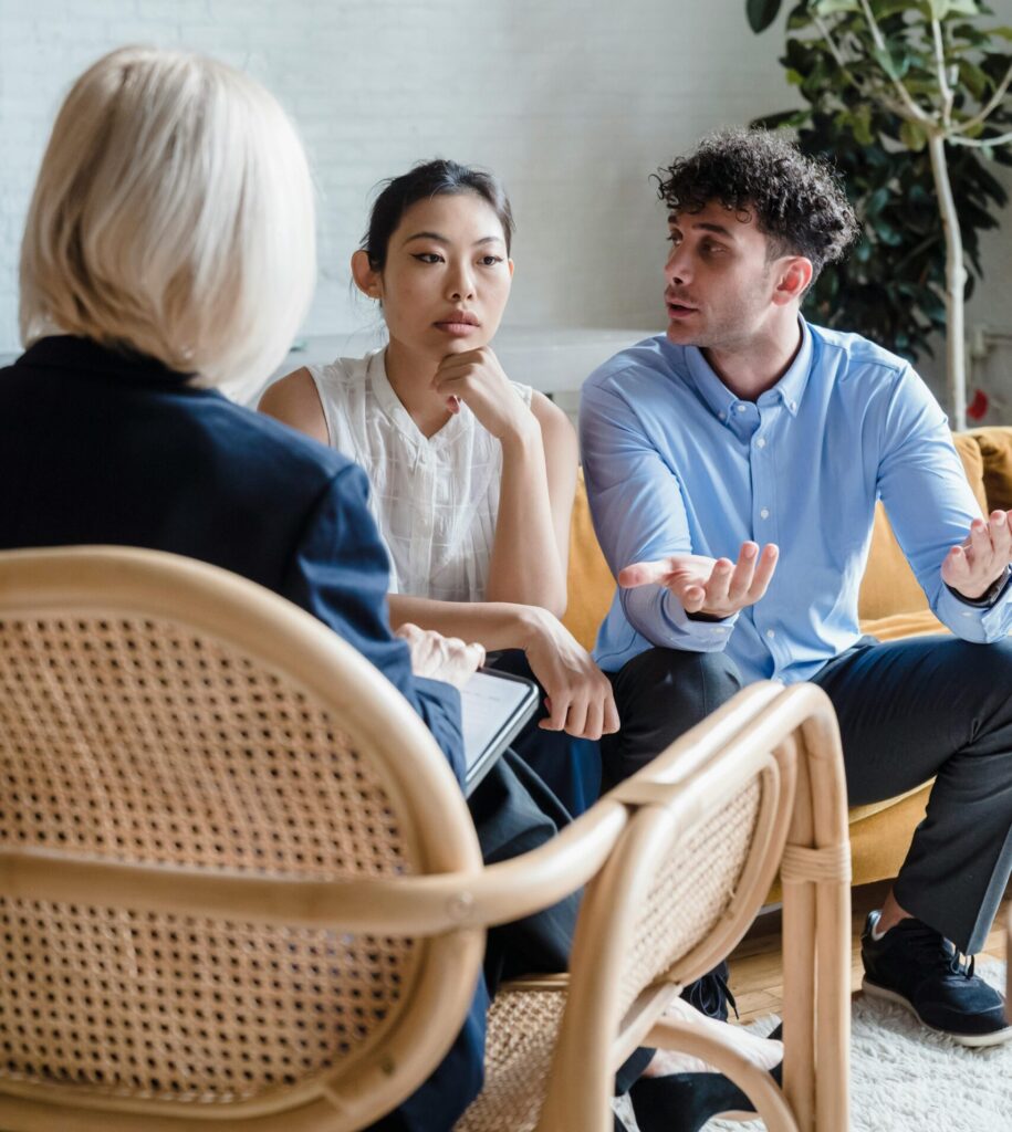 couple getting a divorce talking to a lawyer